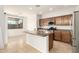 This kitchen features an island, stainless steel appliances, and wood cabinetry at 37808 N Pagoda Ln, Phoenix, AZ 85086