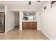 Bright and airy living room featuring tile flooring and a seamless flow into the open kitchen at 37808 N Pagoda Ln, Phoenix, AZ 85086