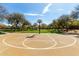 Outdoor community basketball court with well-maintained surface and surrounding trees at 3781 S Pablo Pass Dr, Gilbert, AZ 85297