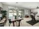 Dining room with a modern chandelier and a view of the outdoor pool through sliding glass doors at 3781 S Pablo Pass Dr, Gilbert, AZ 85297