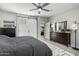 This spacious main bedroom features a barn door leading to the bathroom and a dresser with a mirror at 3781 S Pablo Pass Dr, Gilbert, AZ 85297