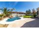 Inviting backyard pool area with a small waterfall, desert landscaping and stamped concrete patio at 3781 S Pablo Pass Dr, Gilbert, AZ 85297