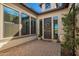 Charming front porch with potted plants and a decorative wreath on a modern door at 3793 E Canyon Pl, Chandler, AZ 85249