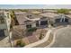 Beautiful single story home with dark garage doors, stone accents, and mature landscaping at 3793 E Canyon Pl, Chandler, AZ 85249