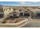 Beautiful single story home with dark garage doors, stone accents, and mature landscaping at 3793 E Canyon Pl, Chandler, AZ 85249