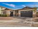 Beautiful home exterior showcasing a large driveway, spacious garage, and manicured landscaping at 3793 E Canyon Pl, Chandler, AZ 85249