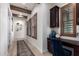 Hallway with wood floors leading to a desk area with natural light and decorative accents at 3793 E Canyon Pl, Chandler, AZ 85249