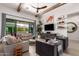 Bright living room featuring high ceilings, wood beams, large windows, and comfortable seating at 3793 E Canyon Pl, Chandler, AZ 85249