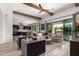 Spacious living room featuring natural light, comfortable seating, and a seamless connection to the kitchen at 3793 E Canyon Pl, Chandler, AZ 85249