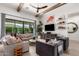 Bright living room featuring high ceilings, wood beams, large windows, and comfortable seating at 3793 E Canyon Pl, Chandler, AZ 85249