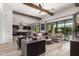 Spacious living room featuring natural light, comfortable seating, and a seamless connection to the kitchen at 3793 E Canyon Pl, Chandler, AZ 85249