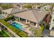 Aerial view of the backyard and private pool with lounge chairs and outdoor seating at 3793 E Canyon Pl, Chandler, AZ 85249