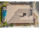 Aerial top-down view of a roof with a unique design, pool, covered patio and lush landscaping at 3793 E Canyon Pl, Chandler, AZ 85249