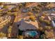 Aerial view of a luxurious desert home with pool, mature landscaping, and outdoor living spaces at 39610 N 12Th St, Phoenix, AZ 85086