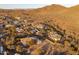 Expansive aerial view of desert homes nestled in a tranquil community near scenic desert mountain landscapes at 39610 N 12Th St, Phoenix, AZ 85086