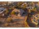 Aerial view of a luxurious desert home with pool, mature landscaping, and outdoor living spaces at 39610 N 12Th St, Phoenix, AZ 85086