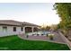 Lush backyard featuring a sparkling pool, mature landscaping, and a spacious lawn area perfect for outdoor enjoyment at 39610 N 12Th St, Phoenix, AZ 85086