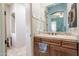 Bathroom featuring light brown vanity, a large mirror and decor at 39610 N 12Th St, Phoenix, AZ 85086