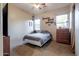 Cozy bedroom featuring a comfortable bed, ceiling fan, and plenty of natural light, ideal for relaxation at 39610 N 12Th St, Phoenix, AZ 85086