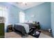 Bedroom featuring a ceiling fan, large window with natural light and decor at 39610 N 12Th St, Phoenix, AZ 85086