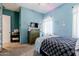 Bedroom featuring light blue painted walls, ceiling fan, dresser and decor at 39610 N 12Th St, Phoenix, AZ 85086