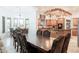 Elegant dining area showcasing a large wood table and a view of the open-concept kitchen at 39610 N 12Th St, Phoenix, AZ 85086