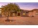 Attractive home featuring a mature tree, desert landscape, and an inviting entrance at 39610 N 12Th St, Phoenix, AZ 85086