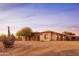 Charming desert home featuring a well-manicured landscape and a desert cactus at 39610 N 12Th St, Phoenix, AZ 85086