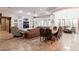 Open concept living room and dining area, featuring stylish furnishings and built-in shelving at 39610 N 12Th St, Phoenix, AZ 85086