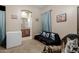 Living room featuring decor, a freezer, and a view into the bathroom at 39610 N 12Th St, Phoenix, AZ 85086