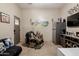 Living room featuring decor, seating and natural light from the door to the exterior at 39610 N 12Th St, Phoenix, AZ 85086