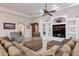 Inviting living room featuring a coffered ceiling, built-in shelving, and cozy seating for relaxation and entertainment at 39610 N 12Th St, Phoenix, AZ 85086