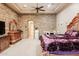 Beautiful main bedroom featuring a stone accent wall, fireplace, and a mini fridge at 39610 N 12Th St, Phoenix, AZ 85086