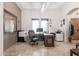 Comfortable office features a large desk and travertine floors, creating an ideal space for work and creativity at 39610 N 12Th St, Phoenix, AZ 85086