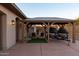 Attached wooden pergola with seating and jet skis on a trailer, offering a relaxing outdoor space at 39610 N 12Th St, Phoenix, AZ 85086