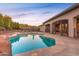 A spacious pool featuring stone accents and wrought iron, as well as several lounge chairs for relaxing poolside at 39610 N 12Th St, Phoenix, AZ 85086