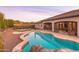 Sparkling backyard pool surrounded by a patio, lounge chairs, and desert landscaping at 39610 N 12Th St, Phoenix, AZ 85086