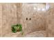 Tiled walk in shower with built in bench, shower head and glass block window at 39610 N 12Th St, Phoenix, AZ 85086