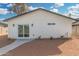 Backyard features desert landscaping and a covered patio with lighting at 42 E 14Th St, Mesa, AZ 85201