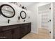 Elegant bathroom boasting a double vanity, modern fixtures, and a walk-in closet at 42 E 14Th St, Mesa, AZ 85201