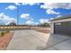 Long, concrete driveway to 2-car garage with baseball stadium in the background at 42 E 14Th St, Mesa, AZ 85201