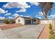 Charming exterior showcasing a well-maintained home with a two-car garage and landscaped front yard at 42 E 14Th St, Mesa, AZ 85201