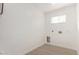 Laundry room features a window and wood-look flooring at 42 E 14Th St, Mesa, AZ 85201