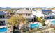 Aerial shot of a home's backyard featuring a fenced pool, patio, desert landscaping and second story balcony at 42829 N Livingstone Way, Anthem, AZ 85086