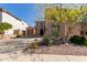 Charming stucco home featuring well-manicured desert landscaping and a private two-car garage at 42829 N Livingstone Way, Anthem, AZ 85086