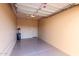 Spacious garage with epoxy flooring and an automatic door, ready for vehicles and storage at 42829 N Livingstone Way, Anthem, AZ 85086