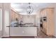 Spacious kitchen with double islands, stainless appliances, and pendant lighting at 42829 N Livingstone Way, Anthem, AZ 85086