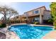 Sparkling blue swimming pool with a house backdrop, a desert garden, and a privacy fence at 42829 N Livingstone Way, Anthem, AZ 85086