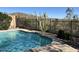 Sparkling pool with a desert view, enclosed by a sleek fence and native cacti at 42829 N Livingstone Way, Anthem, AZ 85086