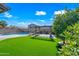 Lush backyard featuring a pergola, and a sparkling pool, offering a serene and private outdoor oasis at 43819 W Wolf Dr, Maricopa, AZ 85138